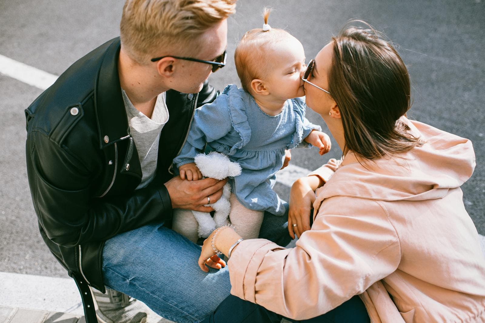 Early-years educator engaging warmly with young children during the day